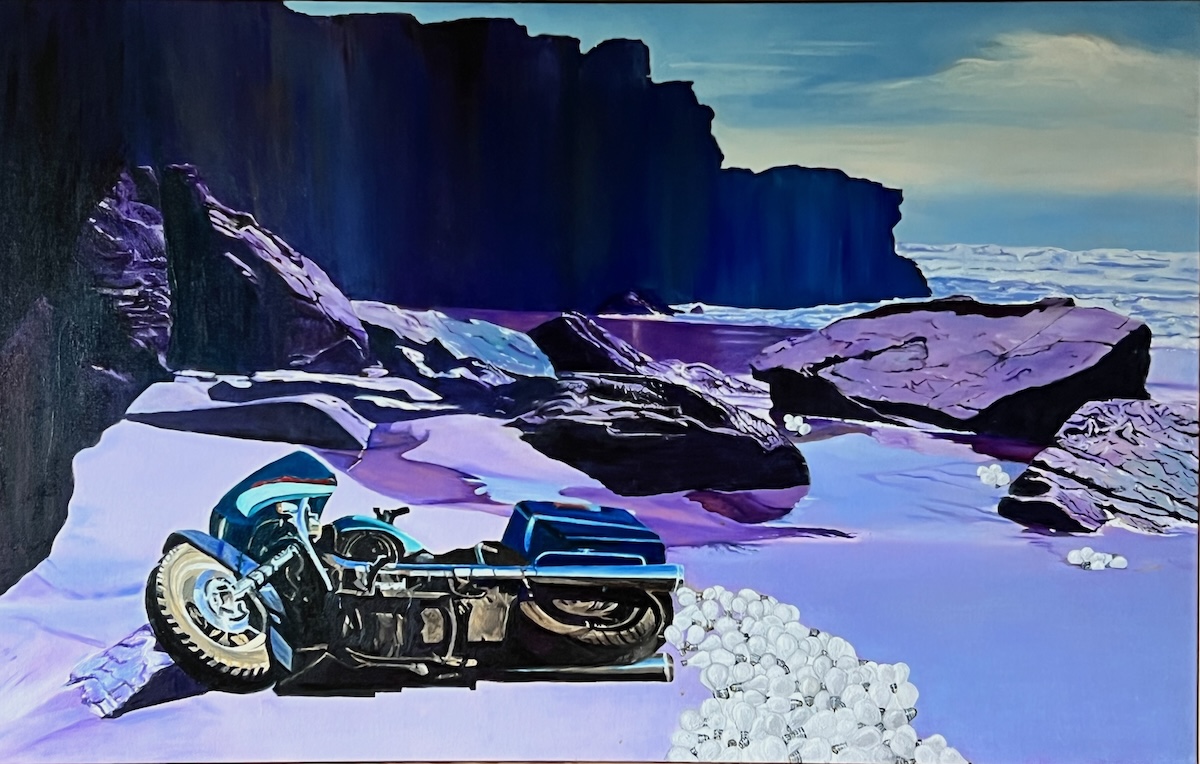 Abandoned motorcycle laying on its side on a rocky beach with scores of lightbulbs spilled from hard shell side bags.